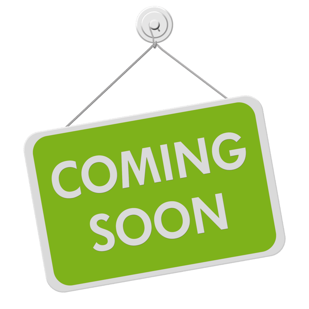 A green sign with text that reads "Coming Soon"