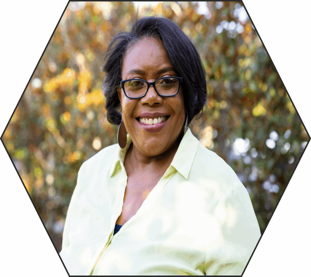 Author photo of Kristene Fields, a Black woman with short black hair and glasses, wearing a pale yellow blouse.